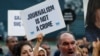 FILE - Demonstrators shout slogans during a protest against the arrest of three prominent activists for press freedom, in central Istanbul, Turkey, June 21, 2016. 