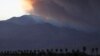 A smoke plume from the Lake Fire in the San Bernardino National Forest is seen at sunset, rising over the Coachella Valley from Palm Springs, California, June 18, 2015. 