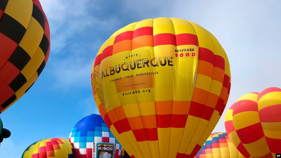 Hot air balloons are inflated during the annual Albuquerque International Balloon Fiesta in Albuquerque, N.M., Oct. 5, 2019. 