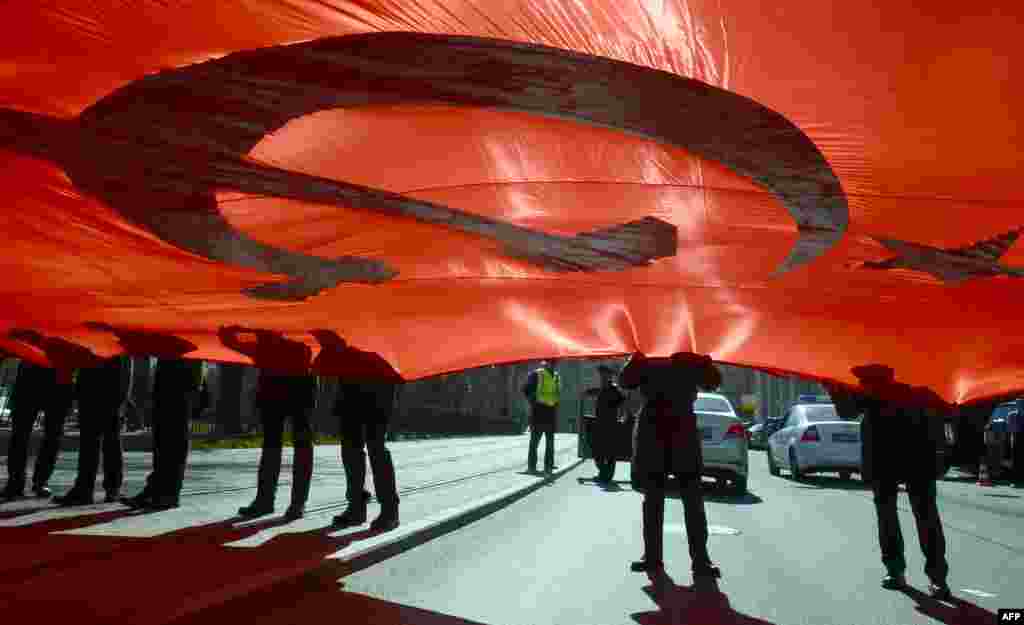Russian military cadets hold a giant replica of the Soviet Banner of Victory as they take part in the Immortal Regiment march in Saint Petersburg. Russia will mark the 72nd anniversary of the 1945 victory over Nazi Germany on May 9.