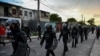 Riot police walk the streets after a demonstration against the government of President Miguel Diaz-Canel in Arroyo Naranjo Municipality, Havana, July 12, 2021.