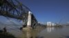 The Radana Thinga Bridge over the Irrawaddy River, still under construction, collapses following an earthquake near Singgu Township in central Burma, November 11, 2012. 