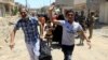 Displaced Iraqi people who fled homes during a fight between Iraqi forces and Islamic State militants are photographed in al-Zanjili neighborhood, north of the Old City district of Mosul, Iraq, May 30, 2017. 