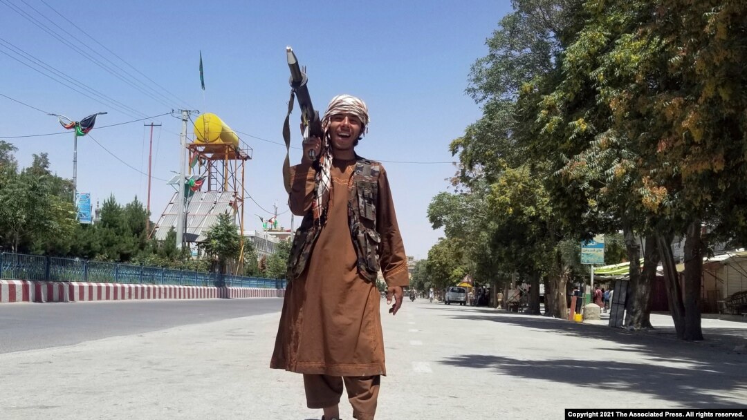 A Taliban fighter patrols inside the city of Ghazni, located in western Afghanistan, Aug. 12, 2021. 