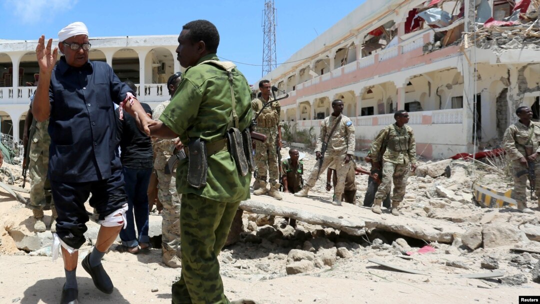 Security forces assist Abdalla Boss, a Somali Member of Parliament who was wounded following a car bomb claimed by al Shabaab Islamist militants outside the president's palace in the Somali capital of Mogadishu, August 30, 2016. 