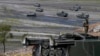 A U.S.-made HIMARS (High Mobility Advanced Rocket System) is displayed amidst armored personnel carriers after taking part in last year's joint U.S.-Philippines military exercise dubbed "Balikatan 2016."