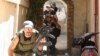 Sunni Muslim gunmen run to take up position in the neighborhood of Bab al-Tebbaneh in Tripoli, northern Lebanon, during sectarian clashes between Sunni Muslims and Alawites, August 24, 2012. 
