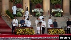 India's President Ram Nath Kovind administers Amit Shah's oath of office during a swearing-in ceremony at the presidential palace in New Delhi, India, May 30, 2019.
