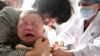 一名儿童2018年7月26日在安徽省一家医院接受疫苗注射（法新社）
