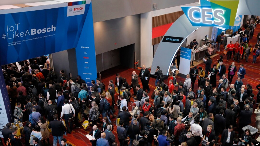 Crowds enter the convention center on the first day of the CES tech show in Las Vegas, Jan. 7, 2020.