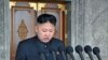 North Korean leader Kim Jong Un delivers a speech during a mass military parade in Kim Il Sung Square, April 15, 2012. 