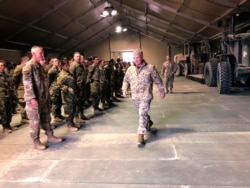Marine Gen. Frank McKenzie, the top U.S. commander for the Middle East, meets with troops at Prince Sultan Air Base in Saudi Arabia, Jan. 29, 2019.