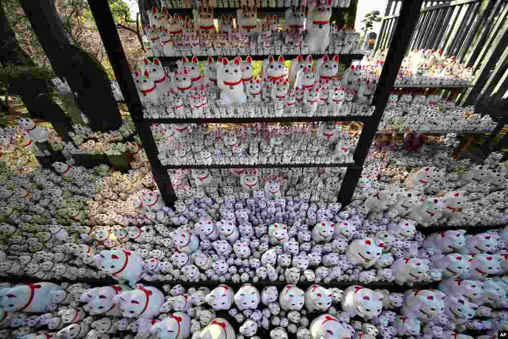 Thousands of "Maneki-neko," or beckoning cat, figurines are placed at the Goutokuji Temple in Tokyo, Japan.