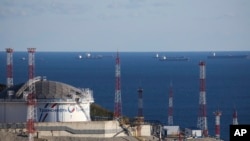 FILE - Oil tankers are seen at the Sheskharis complex, part of Chernomortransneft JSC, a subsidiary of Transneft PJSC, in Novorossiysk, Russia, Oct. 11, 2022. This is one of the largest facilities for oil and petroleum products in southern Russia.