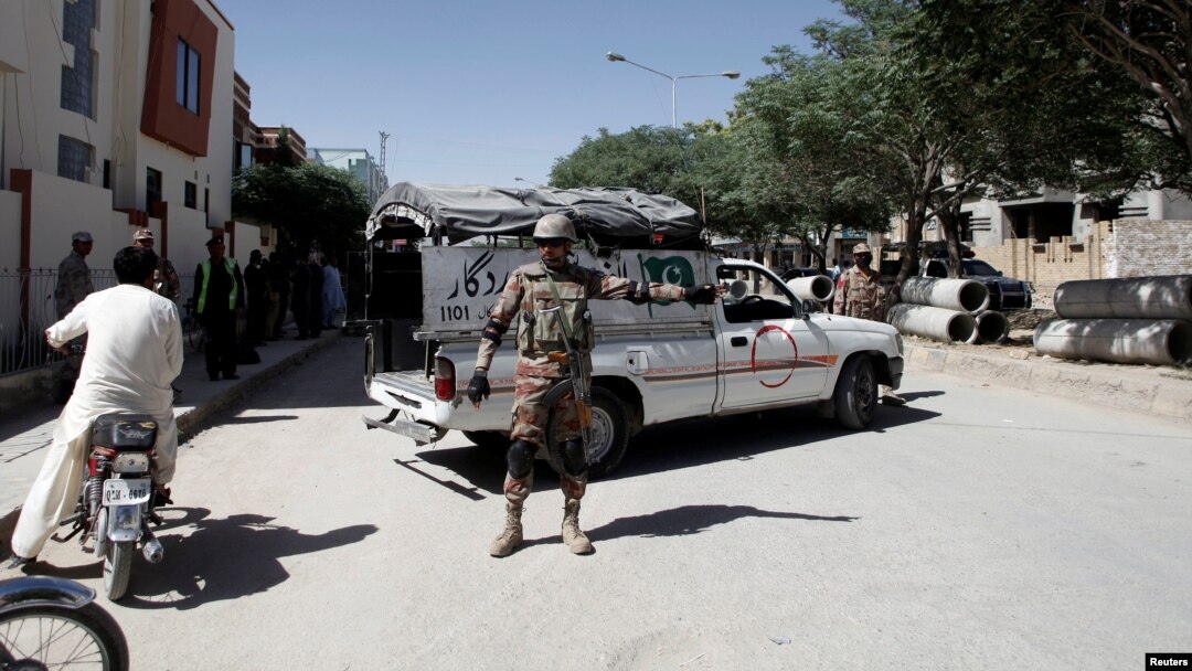FILE - A soldier stands guard near the site where two Chinese nationals were kidnapped by unidentified gunmen, in Quetta, Pakistan, May 24, 2017. 