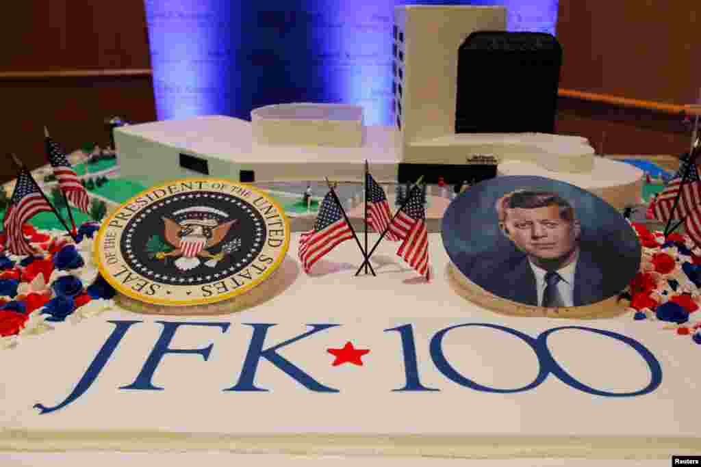 Workers display a large birthday cake on the 100th anniversary of the birth of President John F. Kennedy at the John F. Kennedy Presidential Library in Boston, Massachusetts.