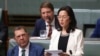 FILE - Gladys Liu, the first Chinese-born lawmaker to be elected to Australia's Parliament, addresses the House of Representatives in Canberra, Australia, July 25, 2019.