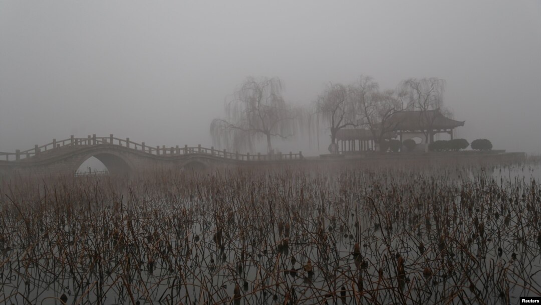 FILE - Heavy smog is seen during a polluted day at the Daming Lake in Jinan, Shandong province, China, Jan. 5, 2017. 