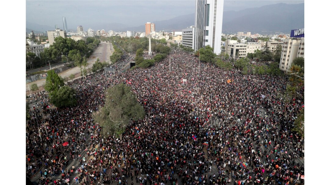 FILE - Demonstrators protest against the government in Santiago, Chile, Nov. 4, 2019.