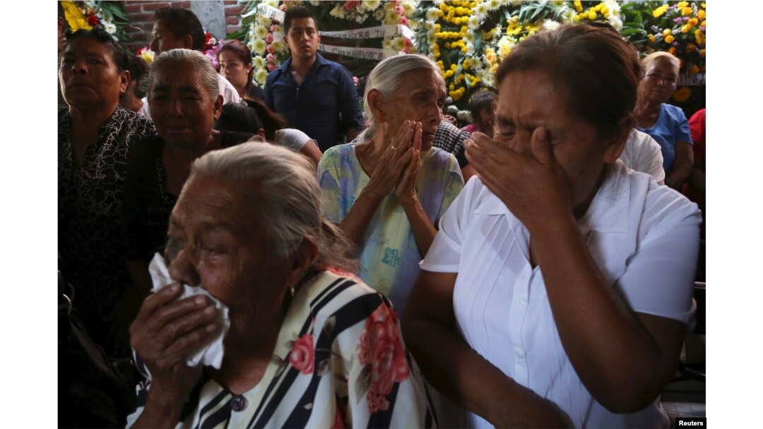 Residents react during the funeral of newly-installed Temixco mayor Gisela Mota in Temixco, south of Mexico City, after Mota was shot dead on Saturday by four armed gunmen.