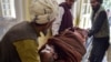 In this photo taken on June 3, 2021, a patient lies on a stretcher before receiving treatment controlled by Taliban militants at a hospital in the Andar district of Ghazni province.