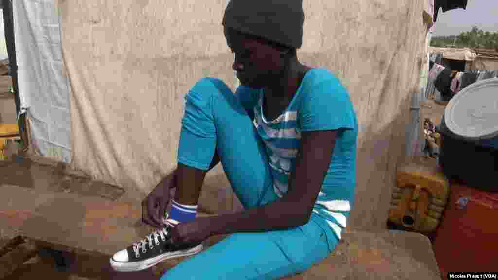 Lami John left Gwoza, in Borno state after Boko Haram attacked his village. She was kidnapped and held for 15 days during which the militants shot her in the leg. (N. Pinault / VOA )