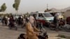 Traffic is stopped as members of Afghan Special Forces regroup after heavy clashes with the Taliban, at a checkpoint in Kandahar province, Afghanistan, July 13, 2021.