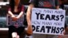 FILE - Refugee advocates participate in a protest in Sydney against the treatment of asylum-seekers at Australia-run detention centers, Nov. 18, 2017. 