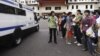 A police van leaves the premises of a dormitory as negotiations with striking bus drivers continue within the building in Singapore, November 26, 2012. 