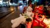 Teddy bears were left together with candles near the Christmas market, where a car drove into a crowd on Friday evening, in Magdeburg, Germany, Dec. 22, 2024. 