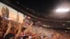 USA fans celebrate after Herculez Gomez scores in the 45th minute VOA / M. Lipin
