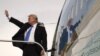 U.S. President Donald Trump waves goodbye as he enters Air Force One in Manila, Philippines, Nov. 14, 2017.