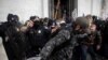 Members of law enforcement clash with pro-Trump protesters storming the U.S. Capitol, in Washington, Jan. 6, 2021.