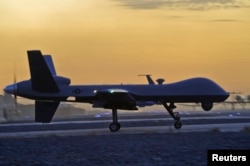 FILE - A MQ-9 Reaper drone taxis at Kandahar Airfield, Afghanistan.