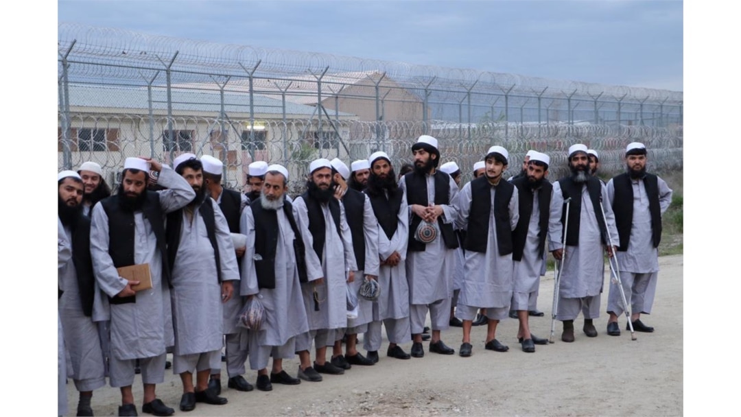 FILE - Newly freed Taliban prisoners line up at Bagram prison, north of Kabul, Afghanistan, April 11, 2020, in this photo provided by the National Security Council of Afghanistan.