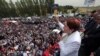 FILE - Meral Aksener, a former Interior minister and the main contester for leadership, addresses supporters as riot police sealed off a hotel to prevent thousands of dissidents in Turkey's opposition Nationalist Movement Party, the MHP, from holding a party congress to oust Devlet Bahceli, leader for the last two decades, in Ankara, Turkey, May 15, 2016.