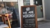 FILE - A 'we are hiring sign' in front of the Buya restaurant in Miami, Florida, March 05, 2021. (Photo by Joe Raedle / Getty Images North America / AFP)