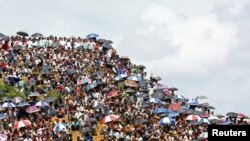 FILE - Rohingya refugees gather to mark the second anniversary of the exodus at the Kutupalong camp in Cox’s Bazar, Bangladesh, Aug. 25, 2019.
