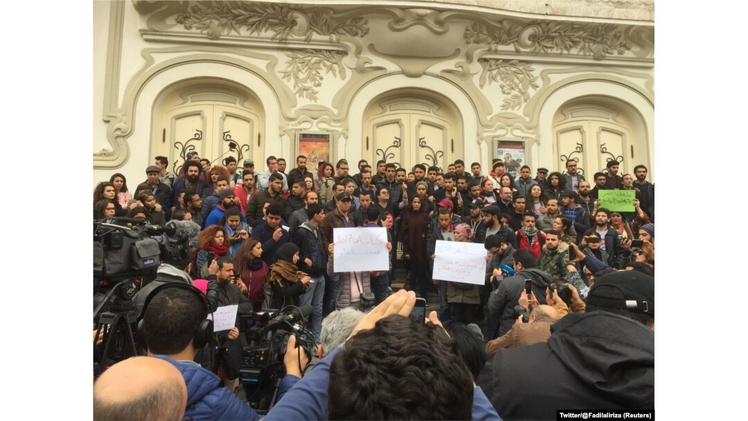 Tunisian activist speaks in front of anti-government protestors in Tunis, Tunisia, Jan. 10, 2018 in this picture taken from social media.
