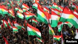 FILE - Kurds celebrate to show their support for Sept. 25 independence referendum in Erbil, Iraq, Sept. 22, 2017.