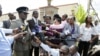 Kenyan Commissioner of Police Mathew Kirai Iteere, left, addresses media on the weekend attack on the police officers in Samburu, northwestern Kenya at Wilson Airport in Nairobi, Nov. 13, 2012. 