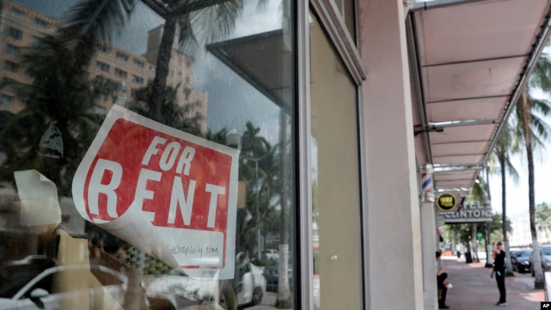 FILE - A 'For Rent' sign hangs on a closed shop during the coronavirus pandemic in Miami Beach, Fla., July 13, 2020. 