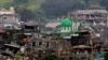 Damaged buildings and houses are seen as government forces continue their assault against insurgents from the Maute group, who have taken over large parts of Marawi city, Philippines, June 22, 2017. 