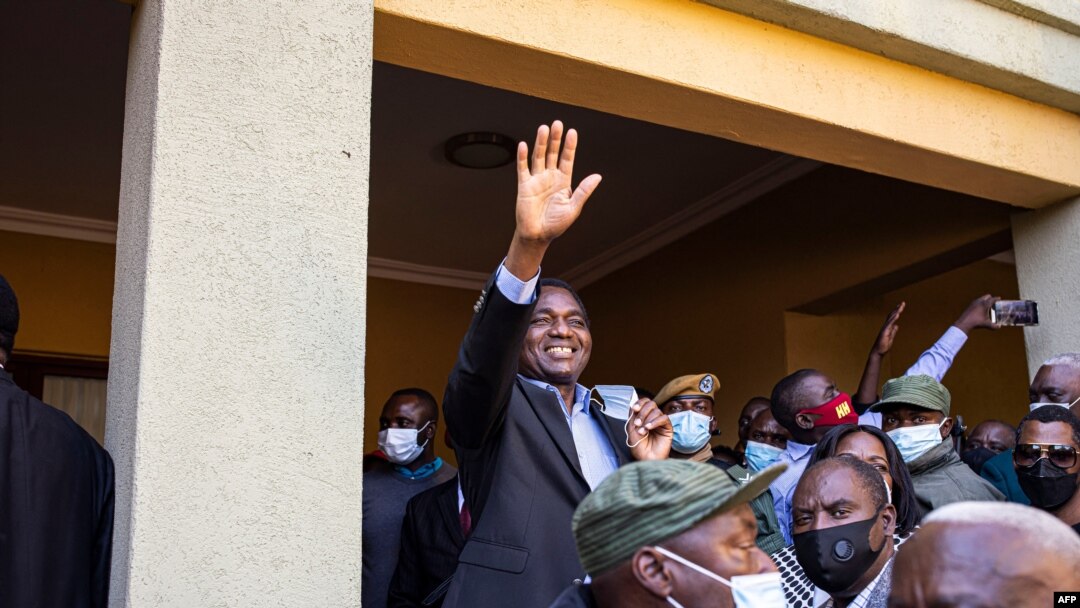 President-elect Hakainde Hichilema (C) waves to supporters after a press briefing at his residence in Lusaka, Zambia, Aug. 16, 2021.