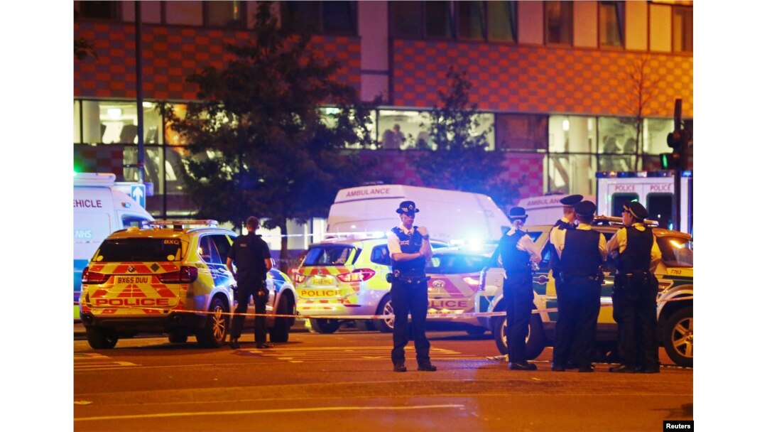 Police officers attend to the scene after a vehicle collided with pedestrians in the Finsbury Park neighborhood of North London, Britain, June 19, 2017.