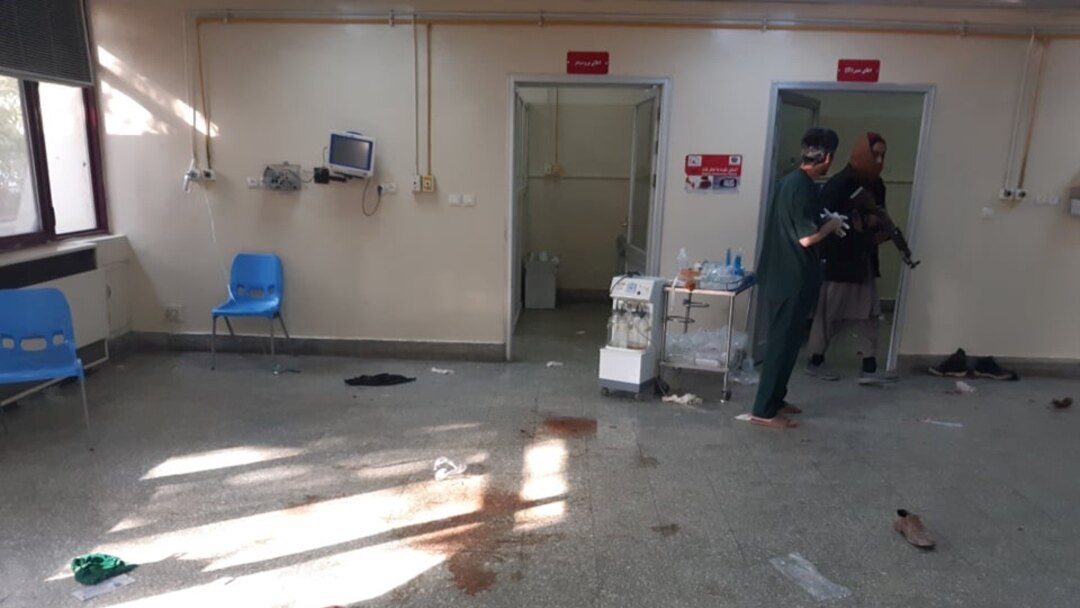 People walk inside the Children's Hospital after an explosion near the Sardar Mohammad Daud Khan National Military Hospital in central Kabul, Afghanistan Nov. 2, 2021.