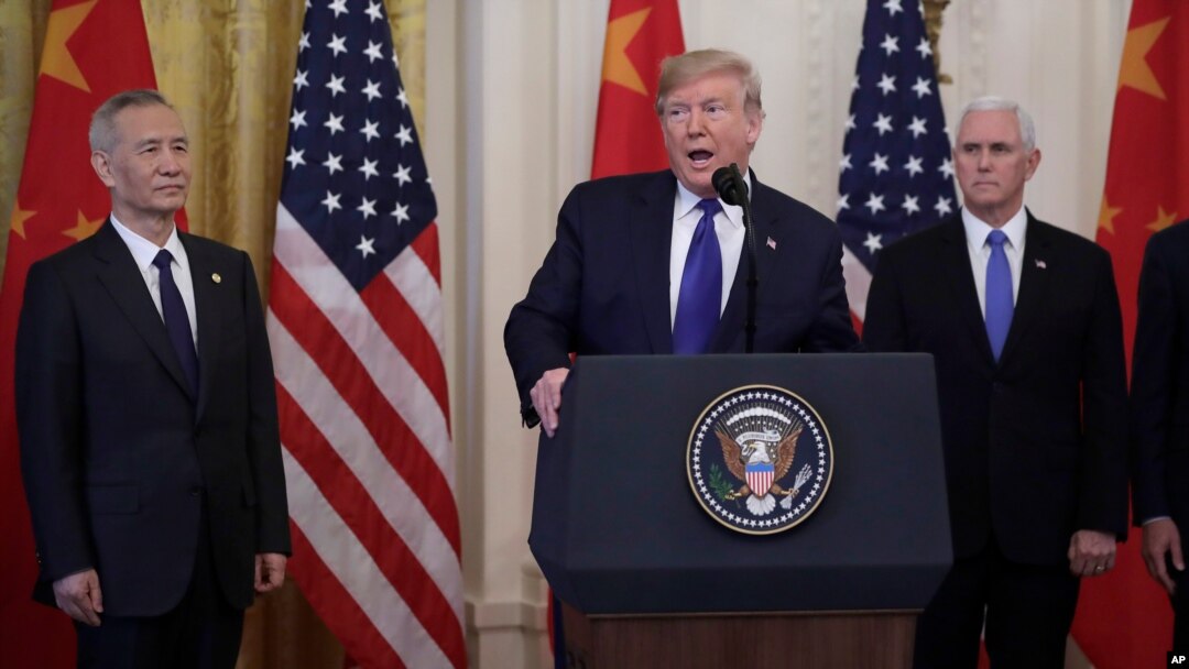 China's Vice Premier Liu He gestures to the media between U.S. Trade Representative Robert Lighthizer (L) and Treasury Secretary Steve Mnuchin before the two countries' trade negotiations in Washington, U.S., October 10, 2019.