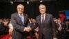 FILE - Australian Prime Minister Scott Morrison and Opposition Leader Bill Shorten shake hands before the first leaders forum at the Seven West Media Studios in Perth, Australia, April 29, 2019. (AAP Image/ The West Australian Pool/via Reuters)