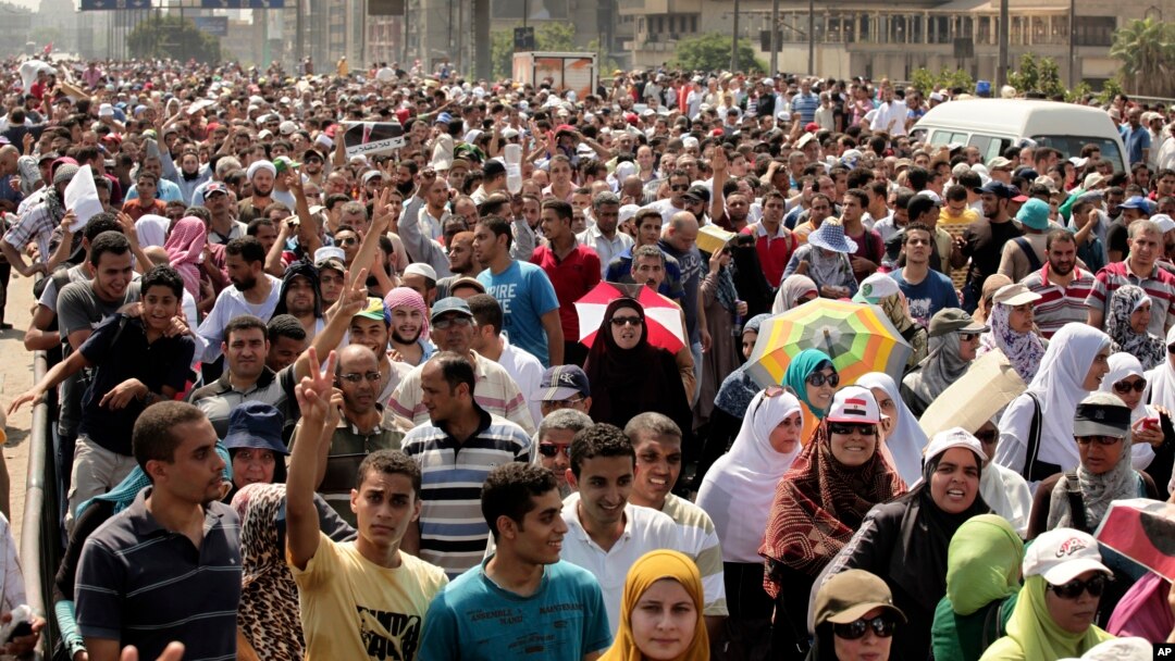 Supporters of ousted Egyptian President Mohamed Morsi cross the Nile as they march towards downtown Cairo from the Mohandeseen neighborhood of Cairo, Egypt, Aug. 16, 2013.