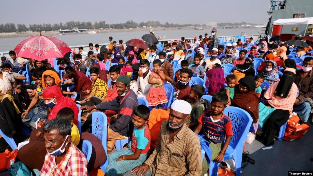 File: Rohingya refugees are seen aboard a ship as they are moved to Bhasan Char island, Bangladesh.